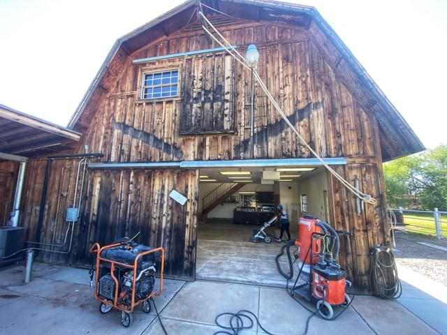 A barn with a concrete floor