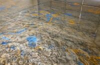 A blue and gray mix of metallic epoxy with orange accents.