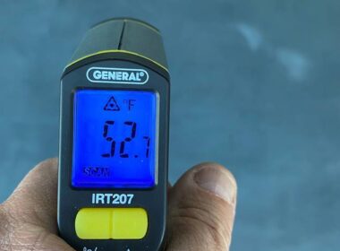 A temp gun reading the temperature of the floor.