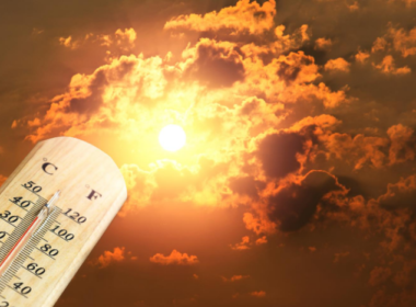 A hot sun with a thermometer measuring the temperature.