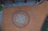 A compass rose on a concrete driveway