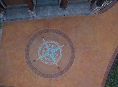 A compass rose on a concrete driveway