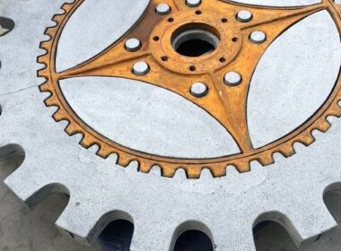 A cut of the concrete table that takes the shape of a machine cog