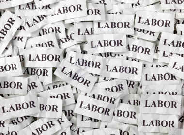 A pile of paper with the word labor on it