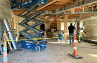 Skudo floor protection protects from large equipment like this lift.