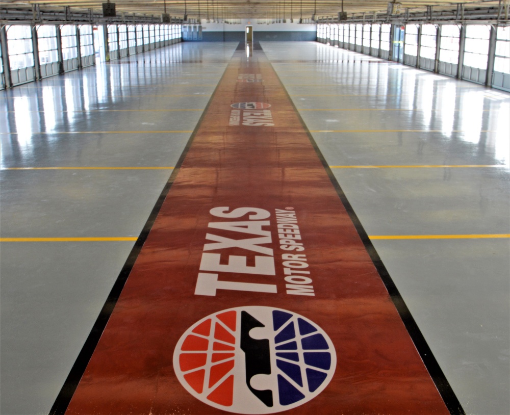 The complete garage at the Texas Motor speedway with a high-performance coating and a custom stencil logo