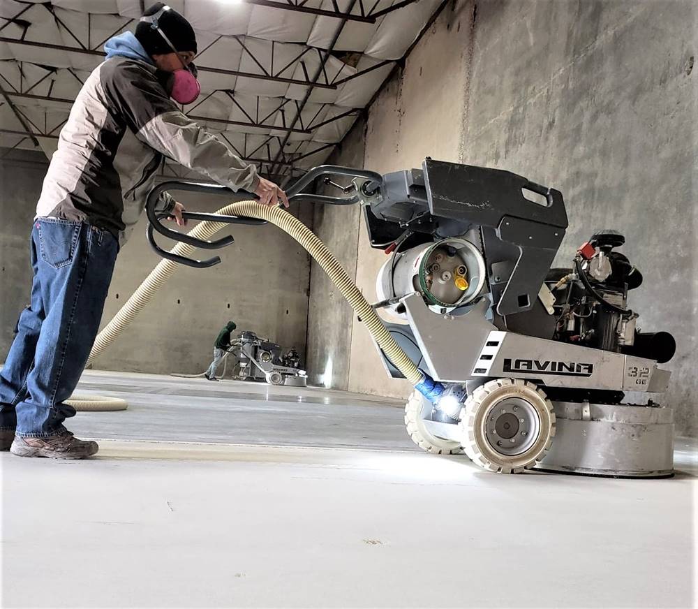 A Lavina polishing machine running on a concrete slab
