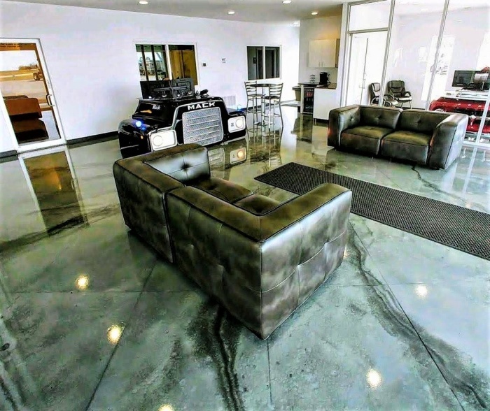 metallic epoxy dust was used in this truck distributor lobby - charcoal, slate and pearl