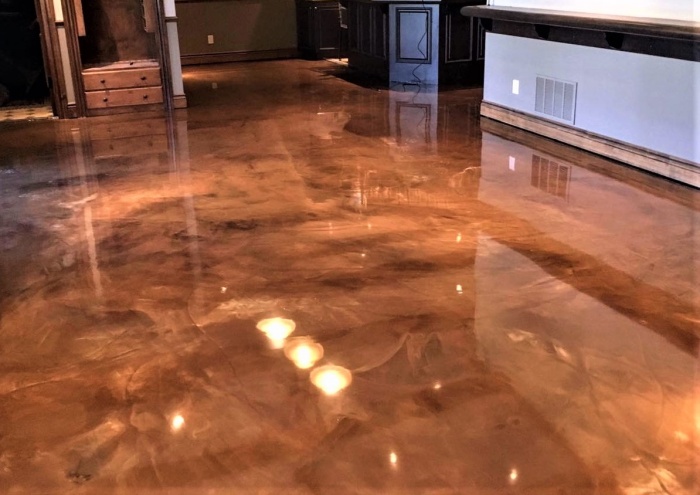 copper metallic epoxy dust was used to create movement and elegence on this concrete floor
