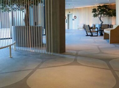 A hotel with stenciled concrete floors