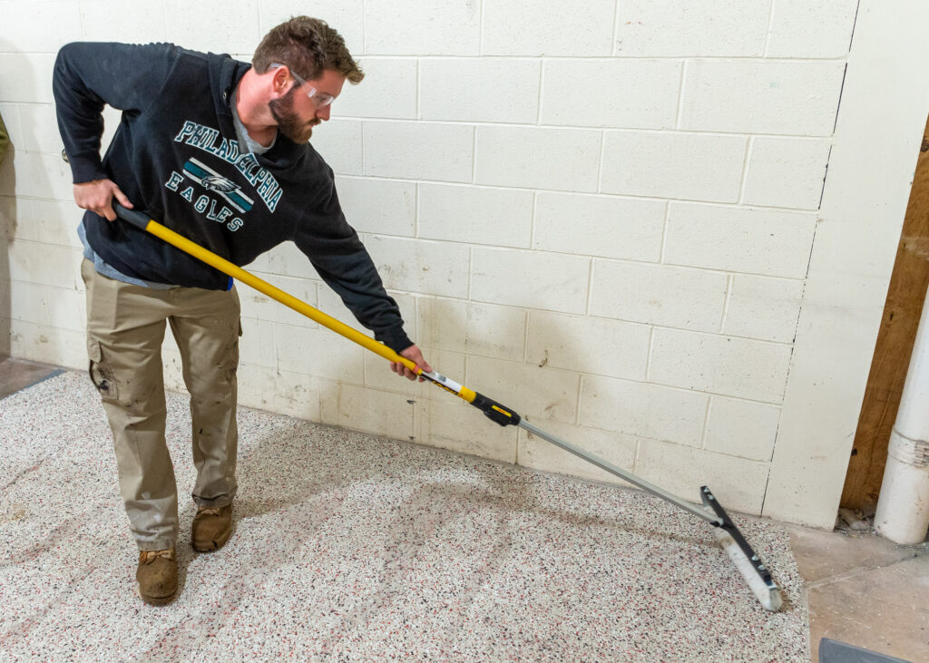 Placing a microtopping with a broom.