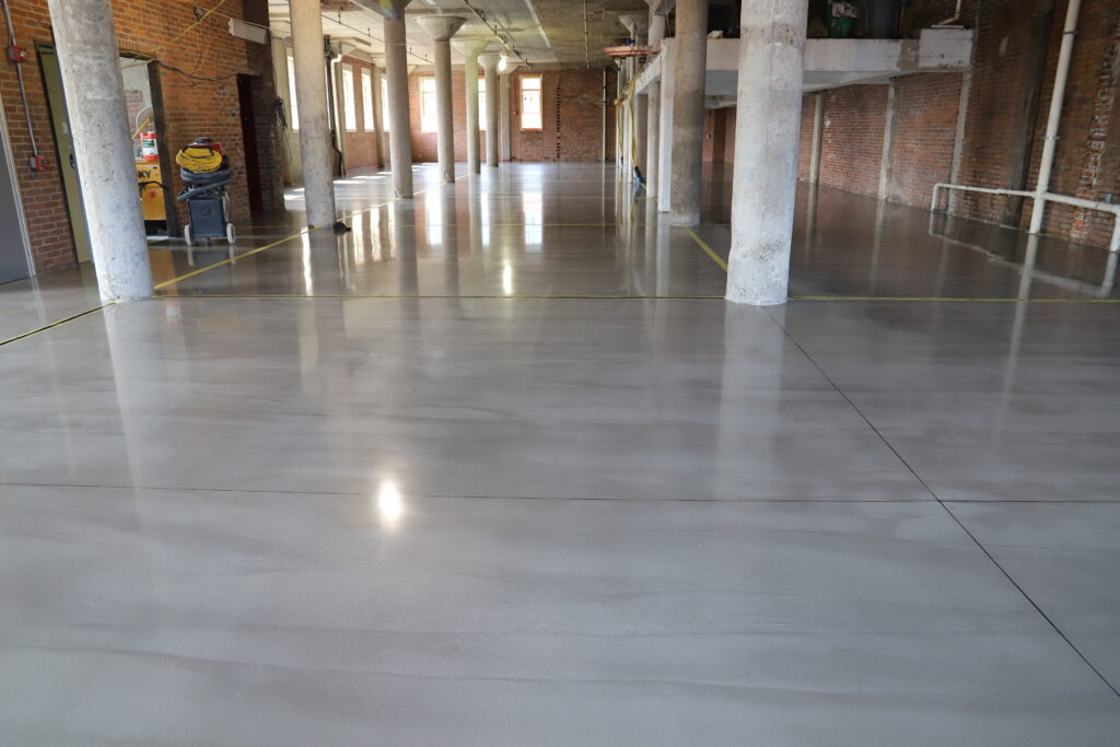A finished polished overlay in a large warehouse space