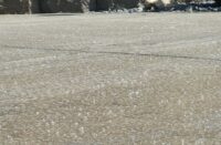 A slab of concrete with sealer on it.
