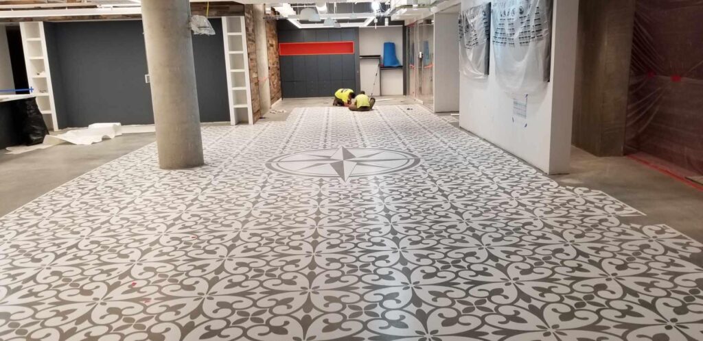 Initially, the stenciled floor featured a crisp white pattern that would be altered to make the floor look worn and faded