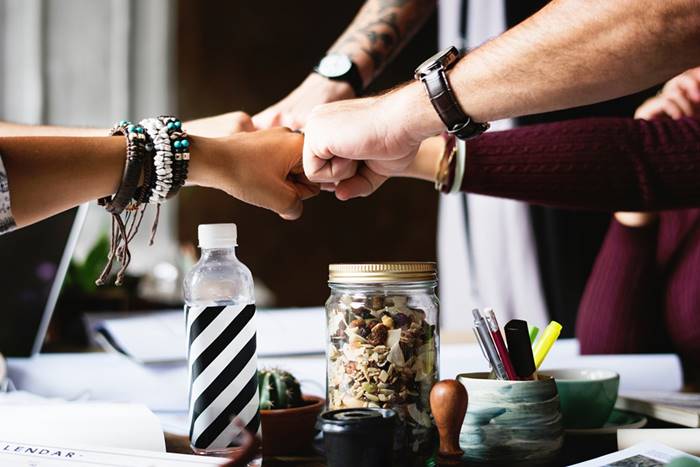 a group people collaborating in marketing and sales functions for the success of their business