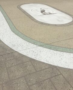 using a concrete stencil on a driveway that is custom made for the centerpiece can go a long way