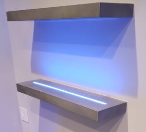 concrete liquor shelves with a lights that match the residential bar