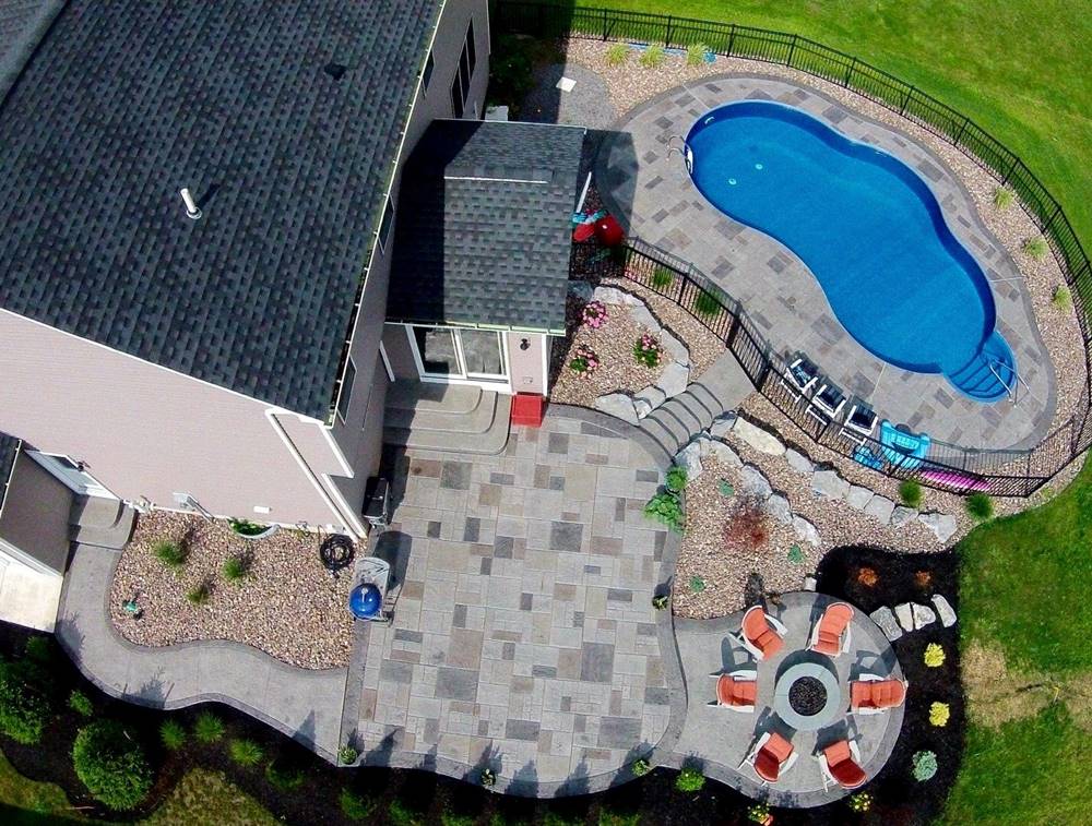 an aerial view of an outdoor concrete patio taken from a drone