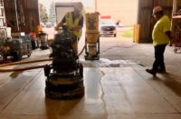 A polishing machine in a warehouse polishing concrete