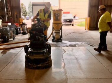 A polishing machine in a warehouse polishing concrete
