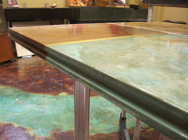 This countertop was cast in a regular rectangular form. The curved indent was created by putting a piece of half round in the form before casting.