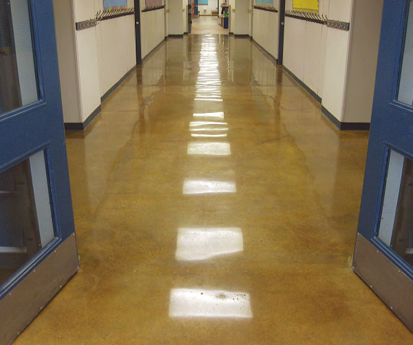 Clint Buswell, Concrete by Design, Alberta, Canada, created the floor in this hallway at St. Matthews Middle School, Rocky Mountain House, Alberta. He used Prosocos Consolideck LS lithium-silicate hardener/densifier and a caramel-color acetone stain to do it. The floor is polished to an 800-grit resin finish, and the glossy microthin lithium-silicate-containing protective coating has been burnished in at 3,000 rpm.