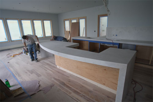 Installing a concrete countertop with a round bar.