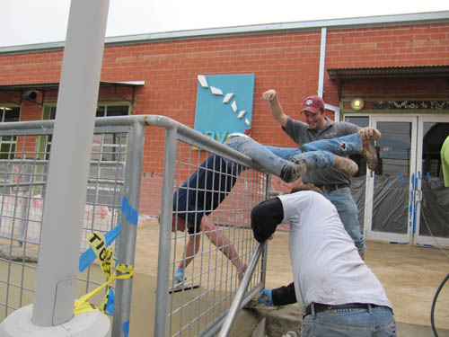 Teamwork to create the final touches on the concrete patio at Say Si in San Antonio.