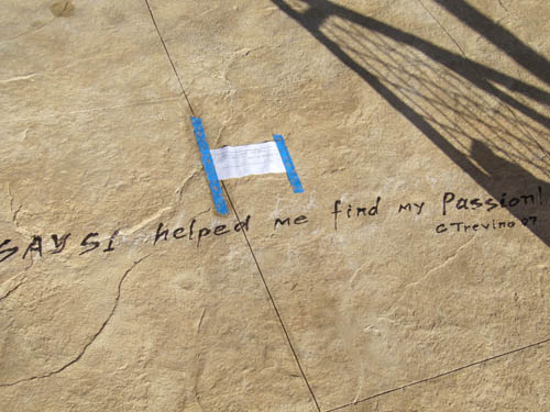 The quote that Say Si helped this student find their passion is placed in the concrete permanently.