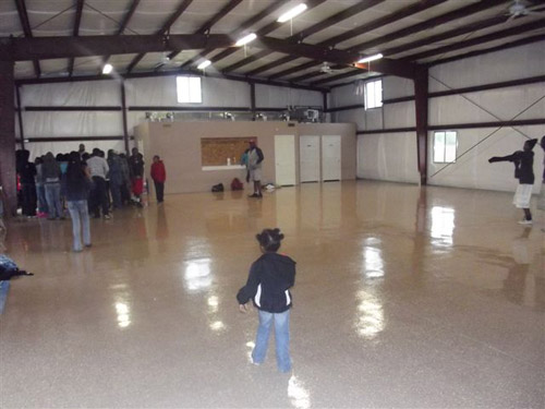 The kids enjoying the newly coated concrete floor.