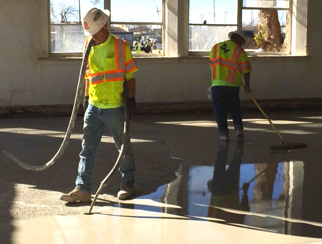 applying self leveling and trowling concrete