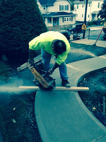 saw cutting a side walk