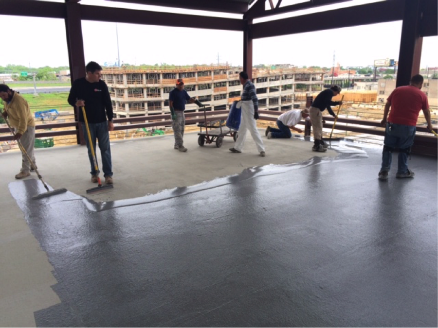 Miracote parking garage restoration - Cementitous traffic coating, first application.