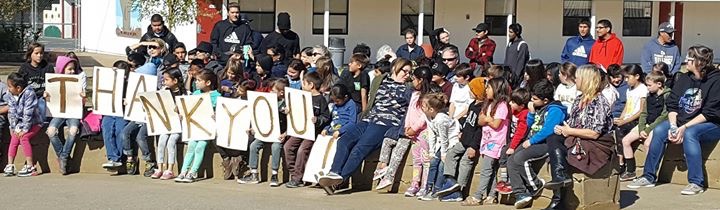 Group of kids gathered to express their thanks to the ASCC
