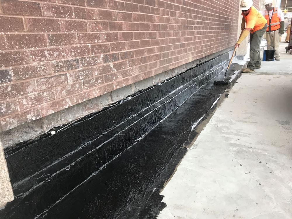 Western Workers Applying Waterproofing at Milner Plaza