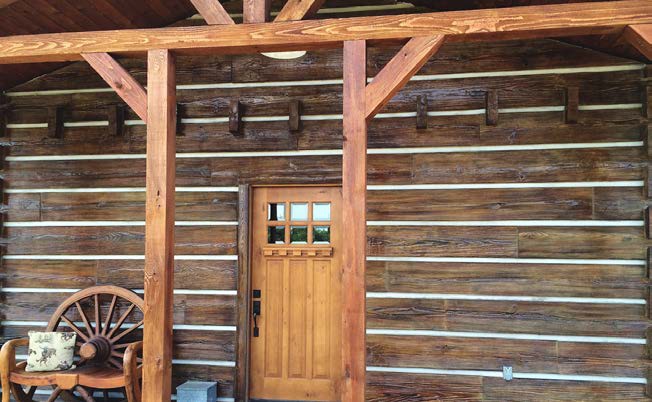 Front of a home made with concrete logs by Everlasting Concrete Logs company