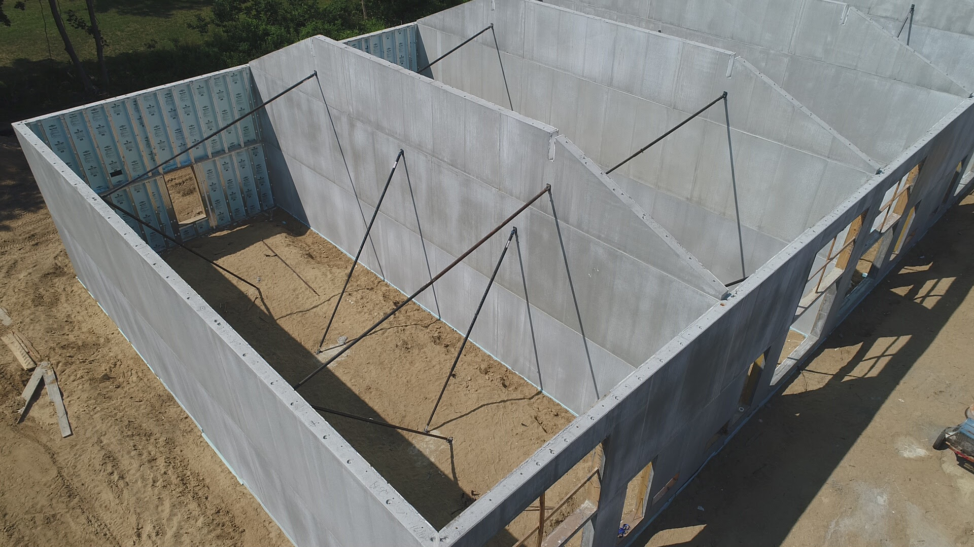Superior Walls Xi wall panels feature steel reinforced concrete and insulation to create a barrier against sidewall water penetration.