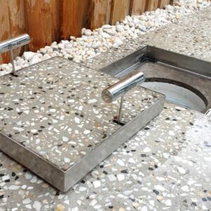Visually appealing HIDE Skimmer Covers by Concrete Countertop Solutions