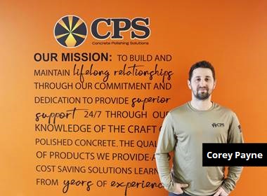 CPS Hires Corey Payne - here Corey Payne poses in front of CPS's mission