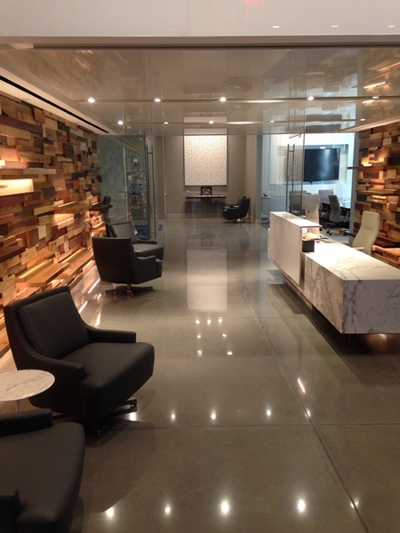 Polished concrete reflecting overhead lights