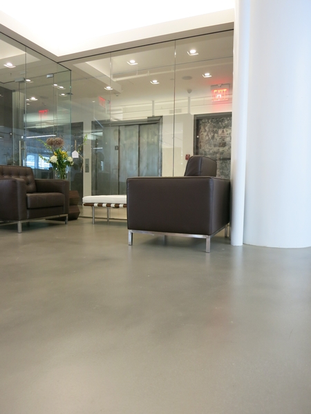 A modern room with concrete floors.