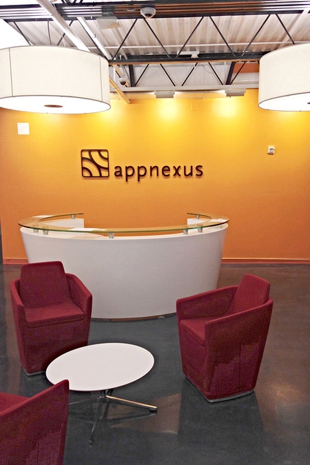 waiting room sporting polished concrete and a yellow wall
