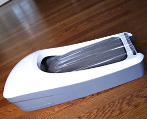 E-Z Floor Guards have a three-step system which applies a sheet of adhesive plastic film to the bottom of a shoe or boot in seconds 2