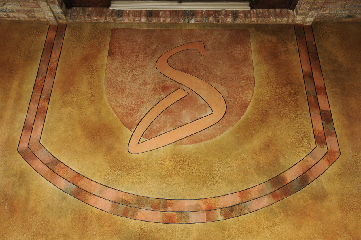 stained concrete design Arkansas Professor letter S