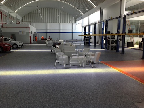 While the Epoxy 200 primer was still wet, four colors of chips - blue, orange, charcoal and green - were broadcast to the point of refusal into the primer, meaning all of the epoxy was completely covered with the flakes and no epoxy was showing. 