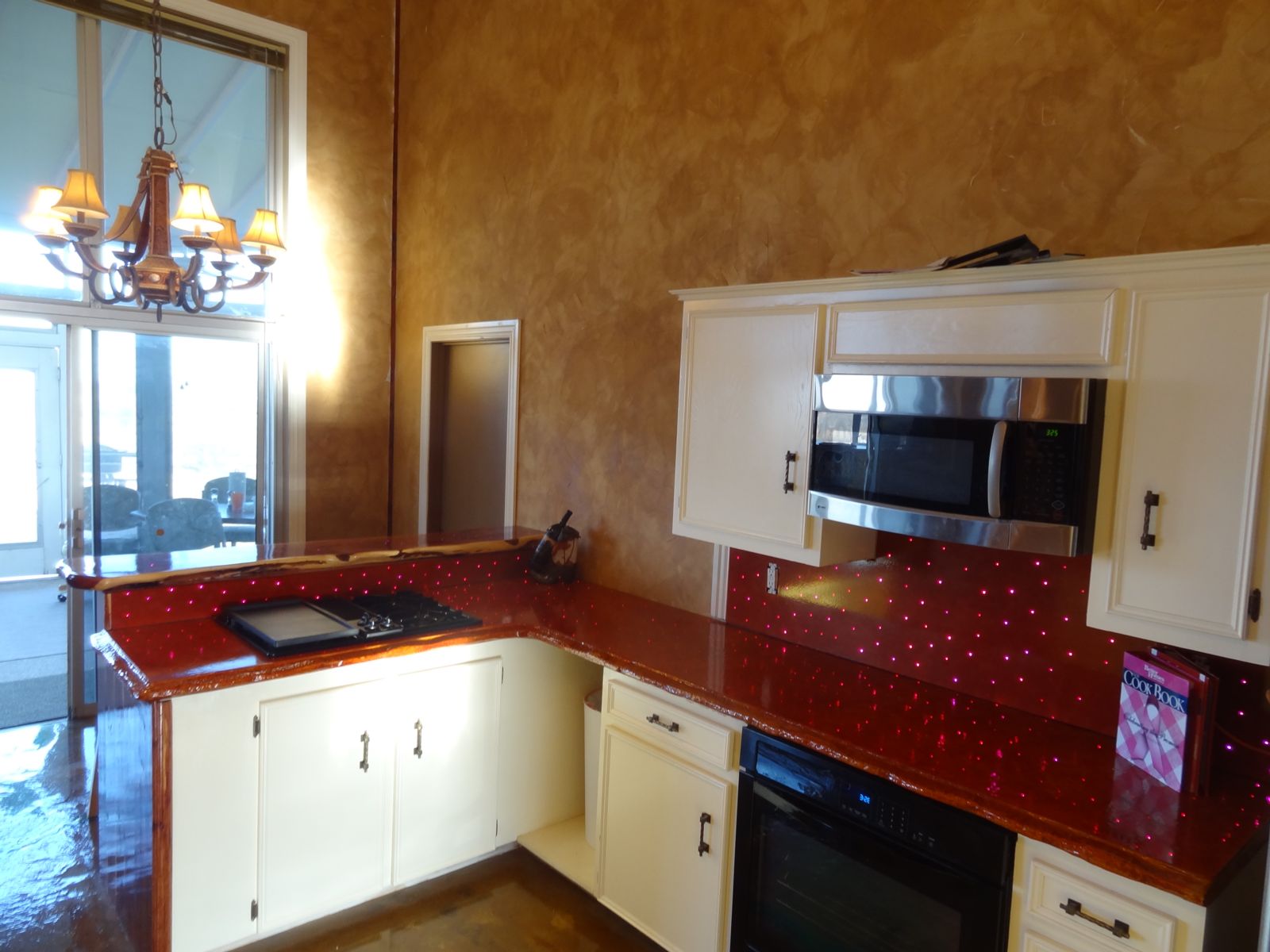 Vibrant red concrete countertops sporting LED lighting