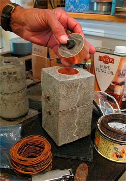 Grayson Malone's work often qualifies as applied art. That is, fine art with a function. This mixed-media piece, which incorporates copper pipe, iron nails, and concrete with integral raw metal powders, is both sculpture and a reliquary. She casts, scores, sands and subsequently finishes with oil. | Photos courtesy of the concretist