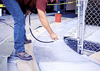 Spraying onto a concrete curb