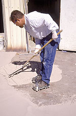 Bob Harris evenly installs Texturetop product with rake.