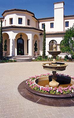 Richard Smith Custom Concrete has created a stamped concrete courtyard with a concrete fountain in the middle.